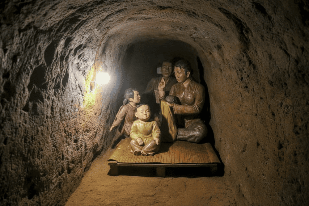 Exhibits include hand tools, personal belongings, and models of the tunnel system